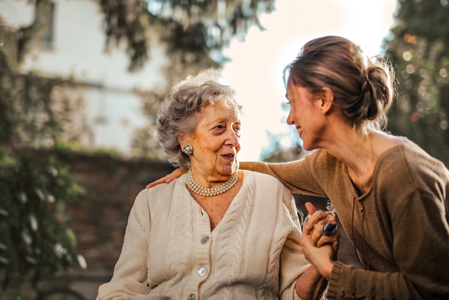 older woman comforted by younger woman